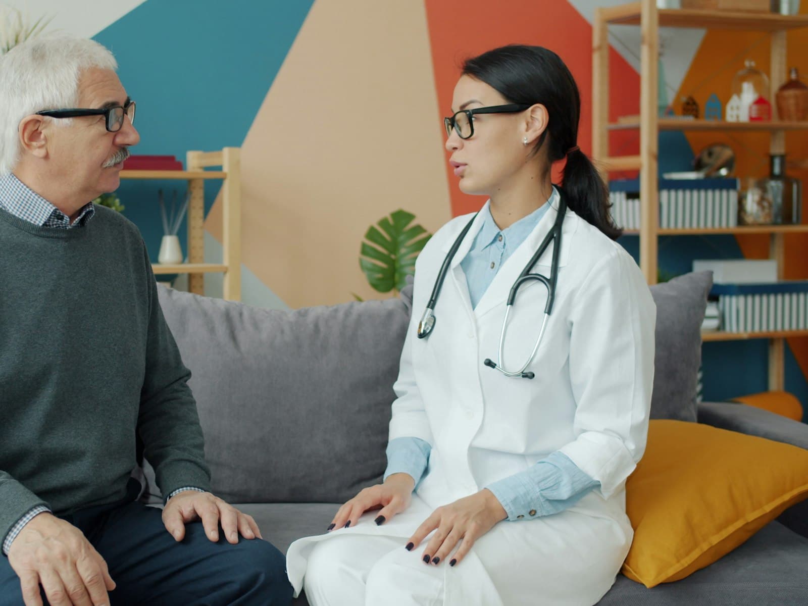 Sample clinician speaking with a patient · stock photo, not a Clinix customer